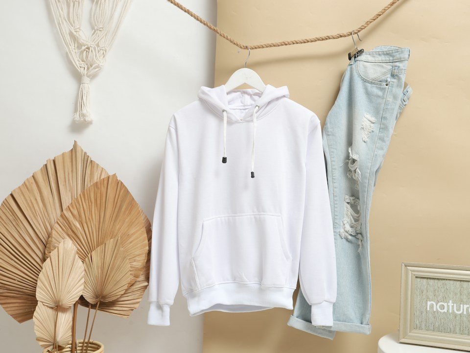 White pullover hoodie shown as a representative garment